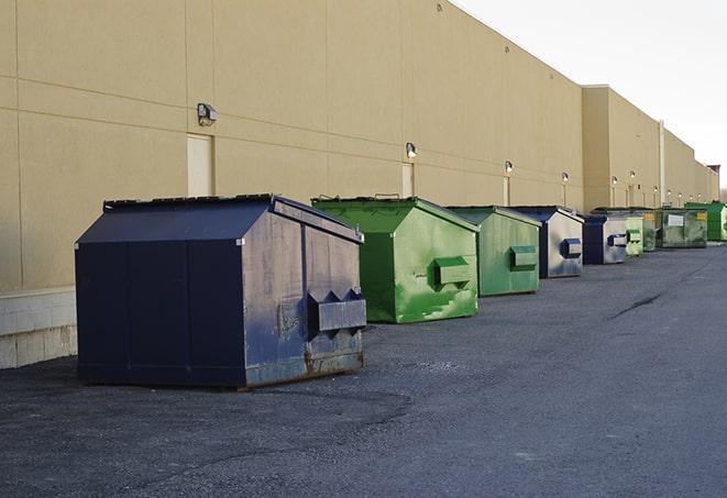 metal waste containers sit at a busy construction site in Chaffee